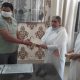 Brahma Kumaris Tosham in-charge BK Manju handing over ₹31,000 relief cheque to SDM Sandeep Kumar for Haryana Corona Relief Fund